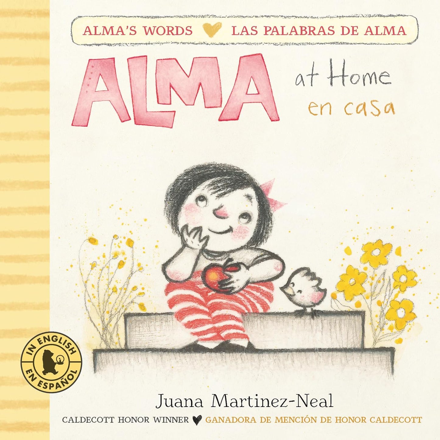 The Alma at Home / en casa bilingual board book, illustrated by Juana Martinez-Neal, shows Alma with an apple and a bird, surrounded by yellow flowers. It includes English and Spanish text and a Caldecott Honor Winner seal on the cover.