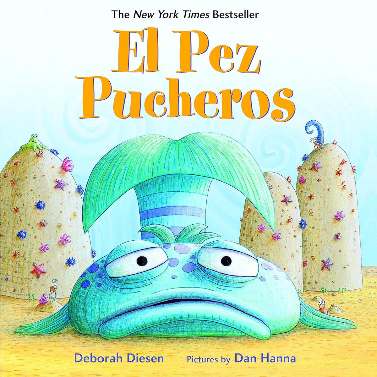 The book cover for El Pez Pucheros by Deborah Diesen, illustrated by Dan Hanna, shows a grumpy fish in green and blue tones. It is surrounded by aquatic-themed rocks with small sea creatures, and the bilingual title is prominently displayed in large orange text at the top.