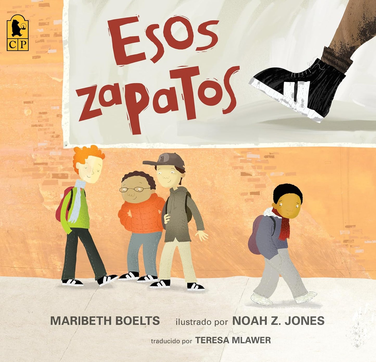 Cover of the childrens book Esos Zapatos by Maribeth Boelts features three kids walking, with one wearing stylish shoes. An orange textured wall is in the background, while a large shoe steps in from above, reflecting the consumer craze central to the story.