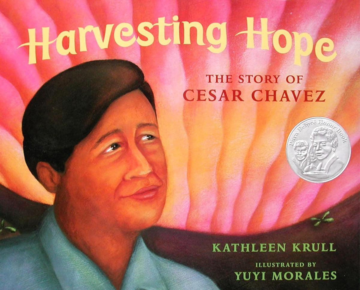 Cover of Harvesting Hope: The Story of Cesar Chavez by Kathleen Krull, featuring illustrations by Yuyi Morales. It showcases a portrait of Cesar Chavez with a vibrant background and a silver award sticker, highlighting the journey of migrant farmworkers.