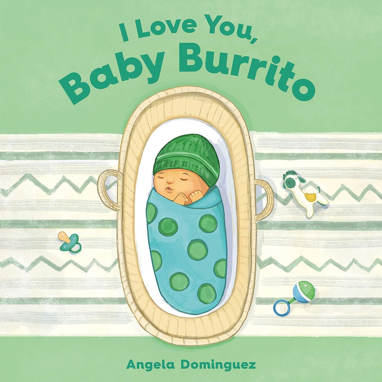 The cover of Angela Dominguezs baby board book, I Love You, Baby Burrito, shows a baby wrapped in a green polka dot blanket, sleeping in a basket against a light green background decorated with pacifiers.