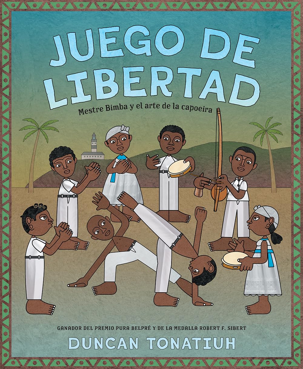 The illustrated cover of Juego de libertad by Duncan Tonatiuh features Mestre Bimba and vibrant capoeira art, showing men and women in traditional attire performing capoeira moves, with drums and a berimbau as musical accompaniments.