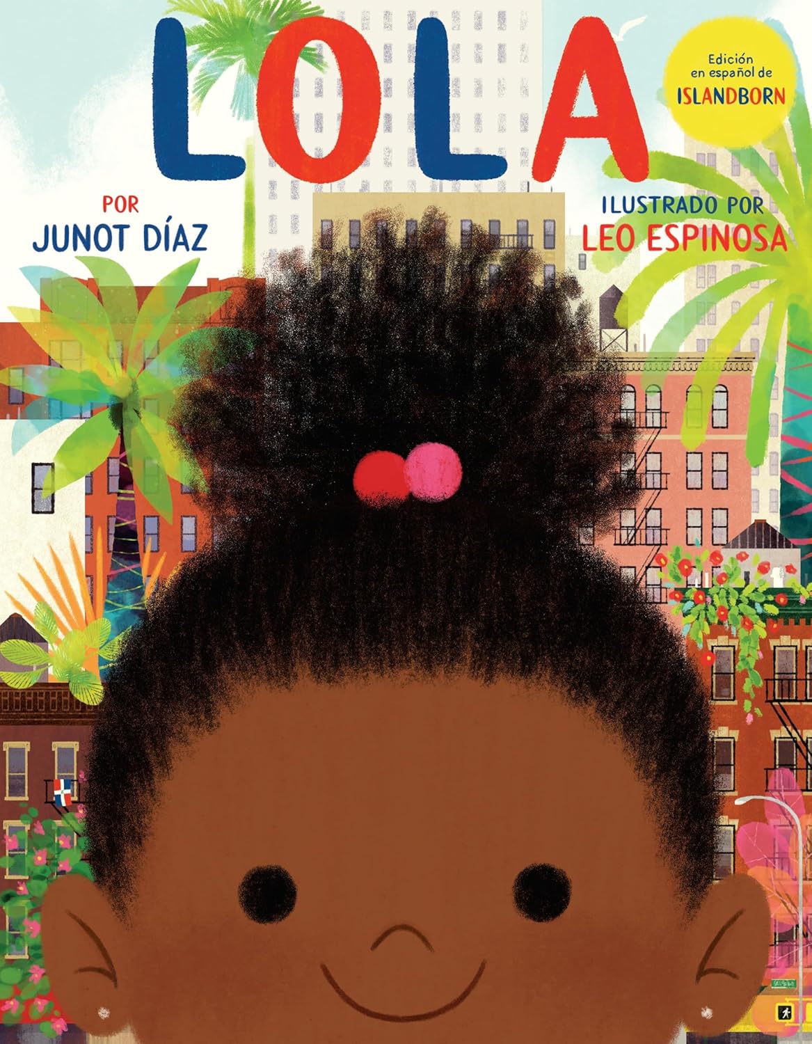The cover of Lola: Edición En Español de Islandborn by Junot Díaz, illustrated by Leo Espinosa, features a smiling afro-haired Lola with a red hair tie amidst a colorful cityscape with palm trees and buildings, in Spanish to inspire imagination.