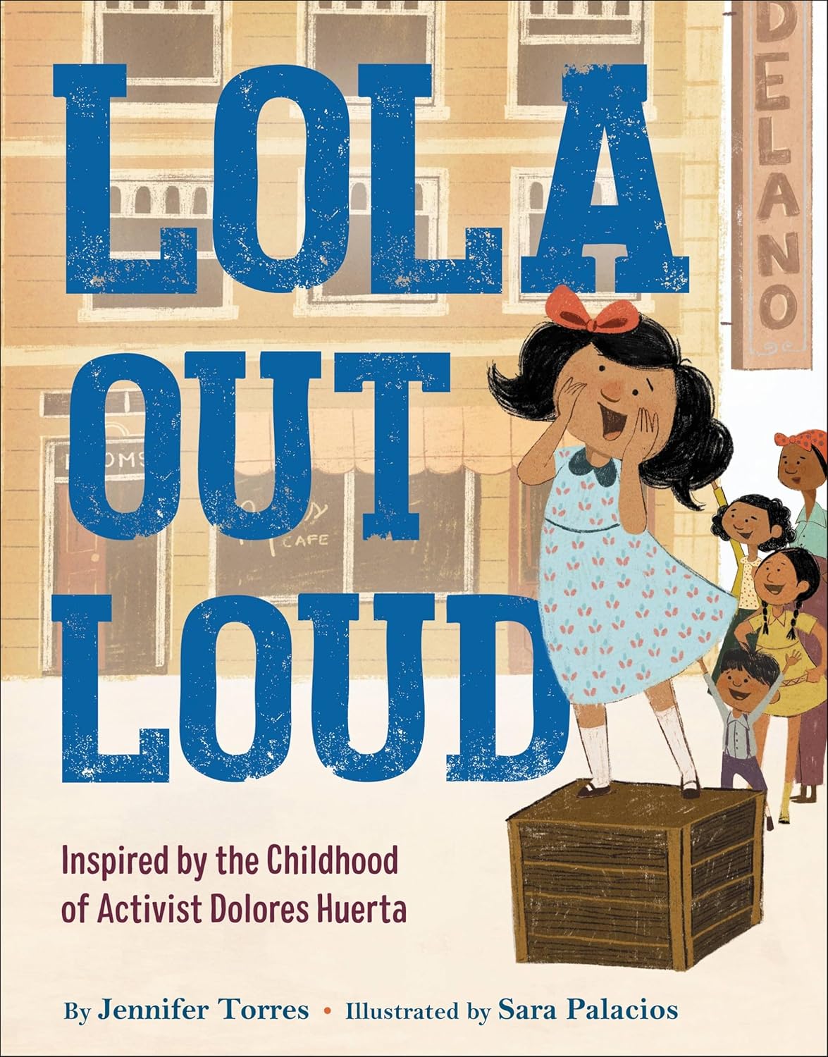 The Lola Out Loud book cover shows an excited girl in a blue polka-dot dress on a box, cheered on by a crowd. Inspired by civil rights activist Dolores Huertas childhood, this inspirational picture book is authored by Jennifer Torres and illustrated by Sara Palacios.