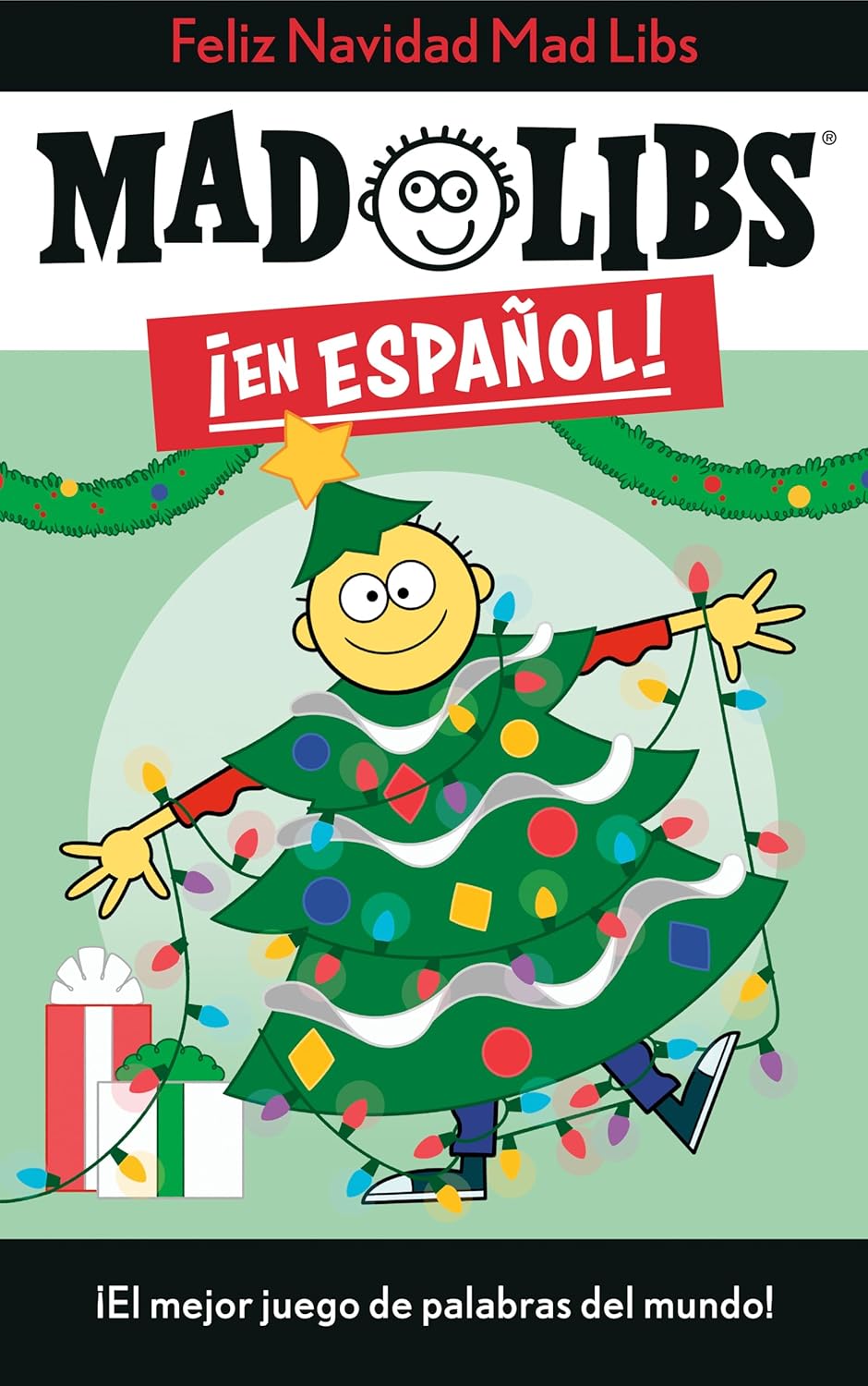 The cover of Mad Libs de navidad en Español features a cartoon character as a Christmas tree, surrounded by gifts, with a banner stating El mejor juego de palabras del mundo! Festive lights and ornaments complete the scene.