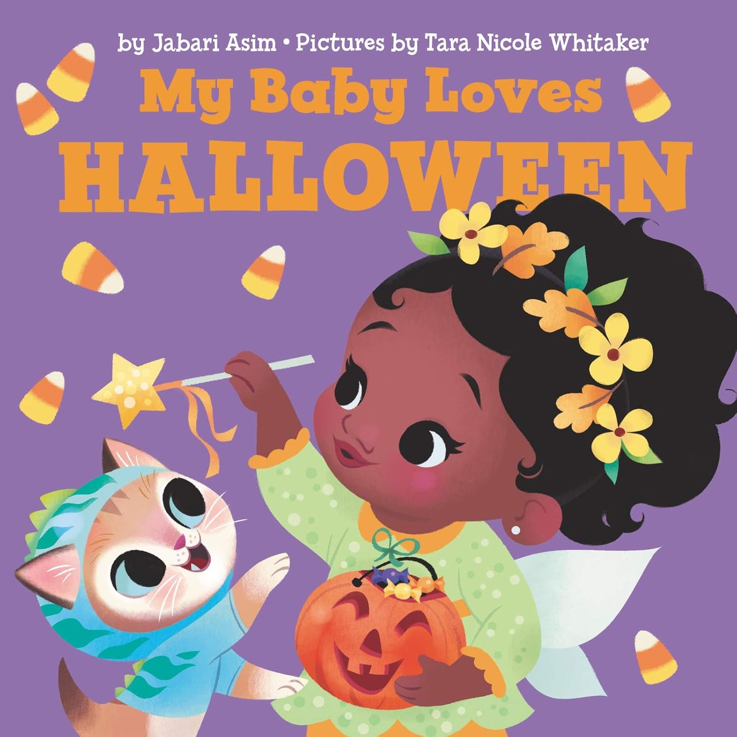 The My Baby Loves Halloween illustrated board book cover shows a baby in a green costume holding a pumpkin bucket, waving candy corn with a wand, while a cat in a blue outfit sits nearby. The book is written by Jabari Asim and illustrated by Tara Nicole Whitaker.