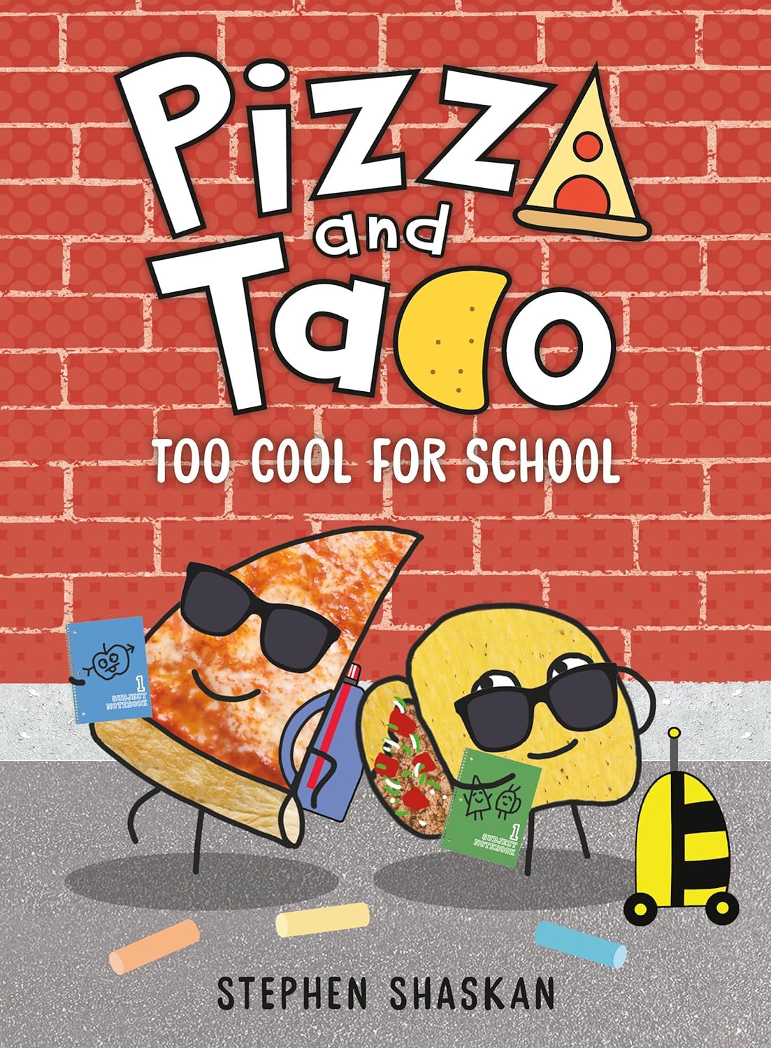 A pizza slice and taco with sunglasses hold books against a chalk-marked brick wall in the young graphic novel Pizza and Taco: Too Cool for School by Stephen Shaskan, perfect for back-to-school fun.