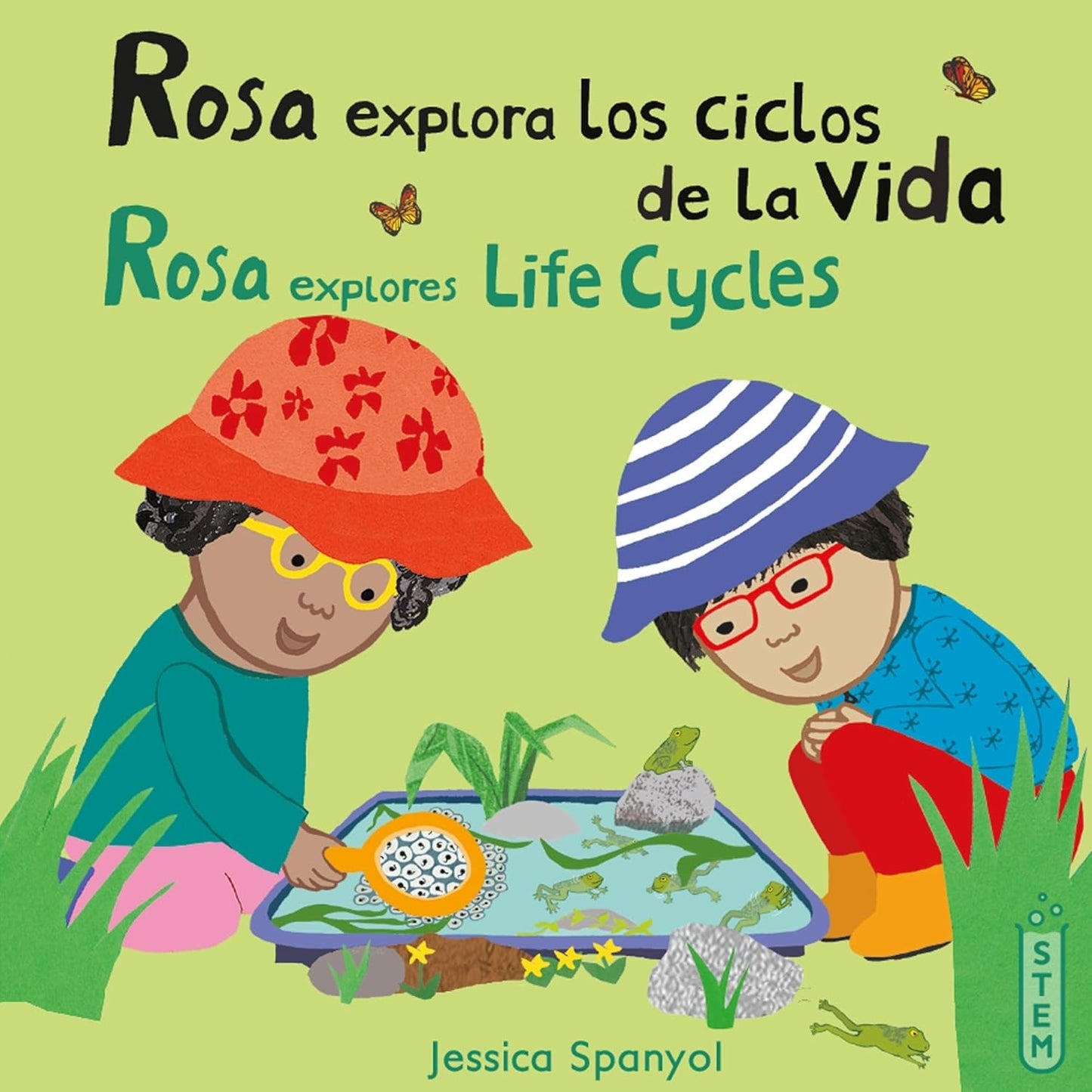 Cover of Rosa explora los ciclos de la vida by Jessica Spanyol. Shows two children watching tadpoles in a pond, merging science with curiosity. The left child wears an orange hat, the right a blue striped hat, with butterflies fluttering in green grass behind them.