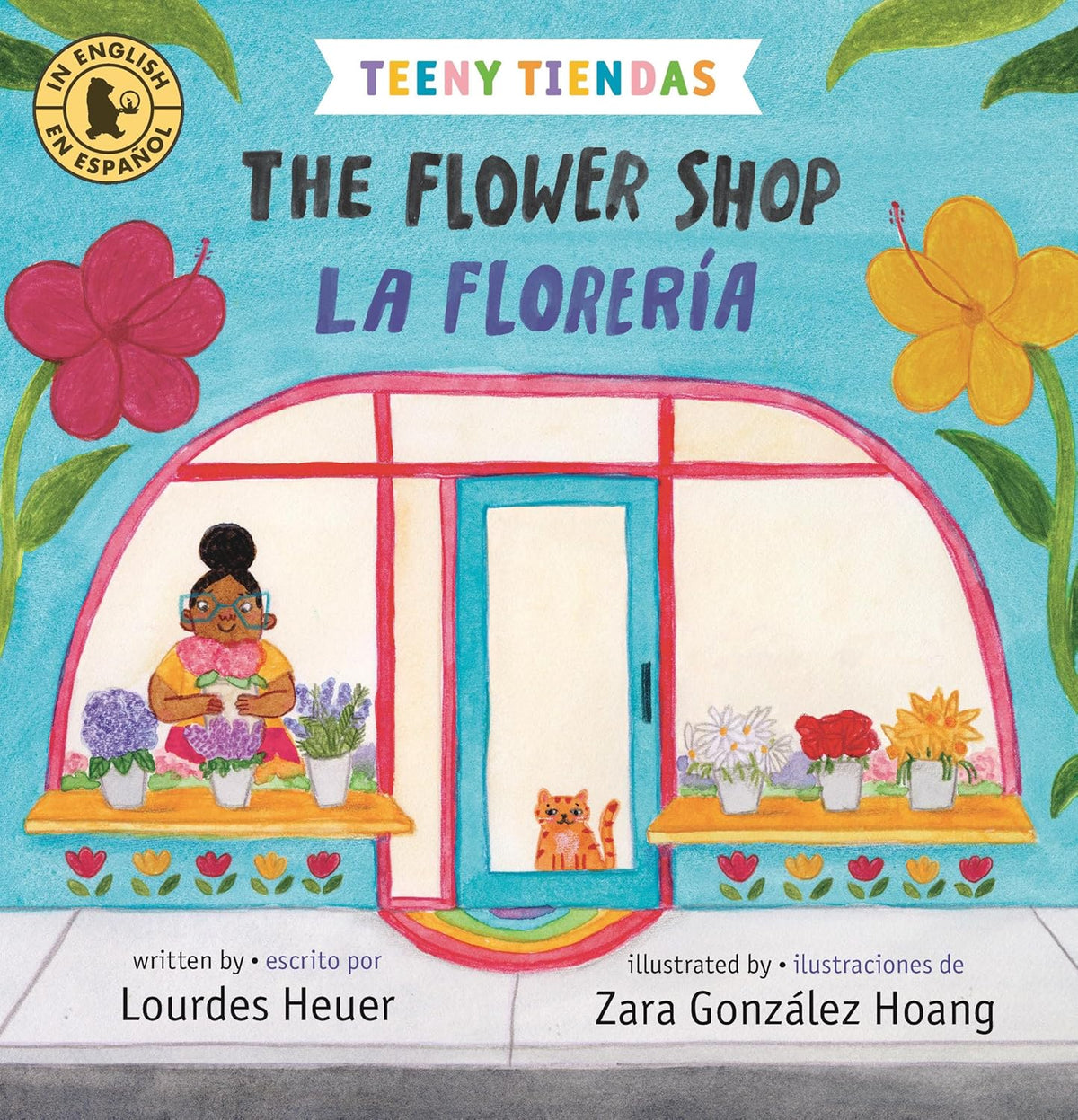 The book The Flower Shop / La Florería by Lourdes Heuer, illustrated by Zara González Hoang, has a vibrant cover showing a woman arranging flowers in a lively shop with a cat. Its adorned with colorful blooms and is bilingual in English and Spanish.