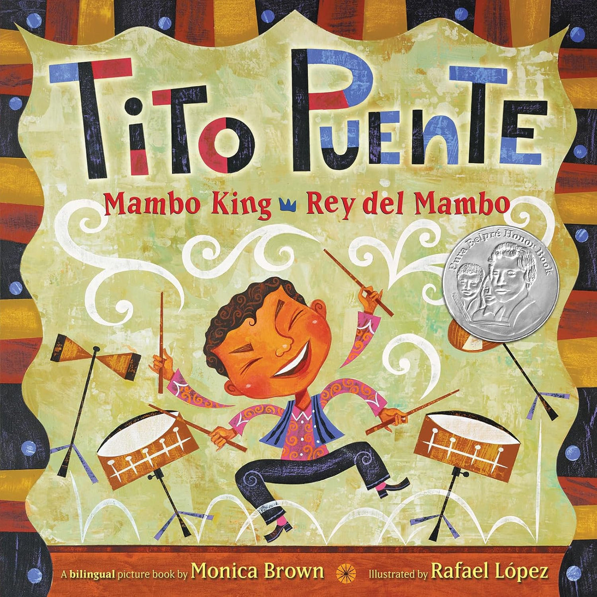 The cover of Tito Puente, Mambo King/Tito Puente, Rey del Mambo: Bilingual English-Spanish shows a smiling cartoon character playing drums vibrantly. A silver award sticker is present, along with author and illustrator credits.