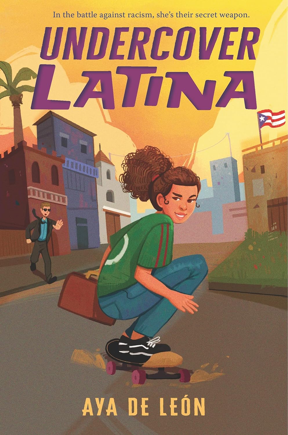 Book cover of Undercover Latina by Aya de León. A Latina teen spy with curly hair skateboards down a street, clutching a briefcase. Background: colorful buildings and a passerby. Text: In the battle against white supremacist threats, shes their secret weapon.
