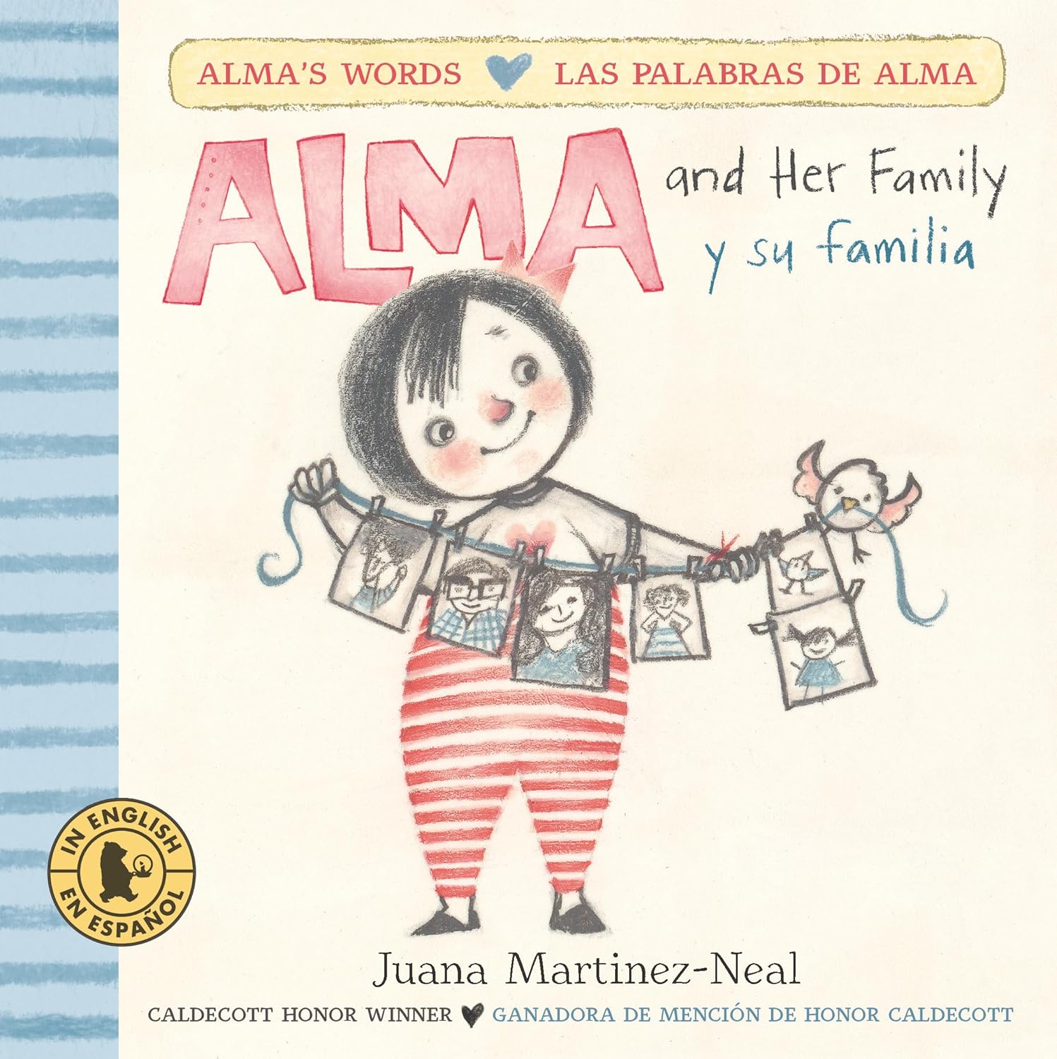 The book cover for Alma and her family / y su familia, a bilingual board book by Juana Martinez-Neal, features an illustrated child in striped pants holding family photos. It includes English and Spanish text and notes its Caldecott Honor mention.