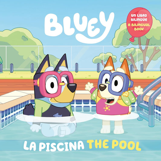 Cover of the bilingual storybook Bluey: La Piscina, featuring cartoon dogs Bluey and Bingo at a pool. Bluey wears goggles in the water, while Bingo, also in goggles, waves cheerfully from the poolside.