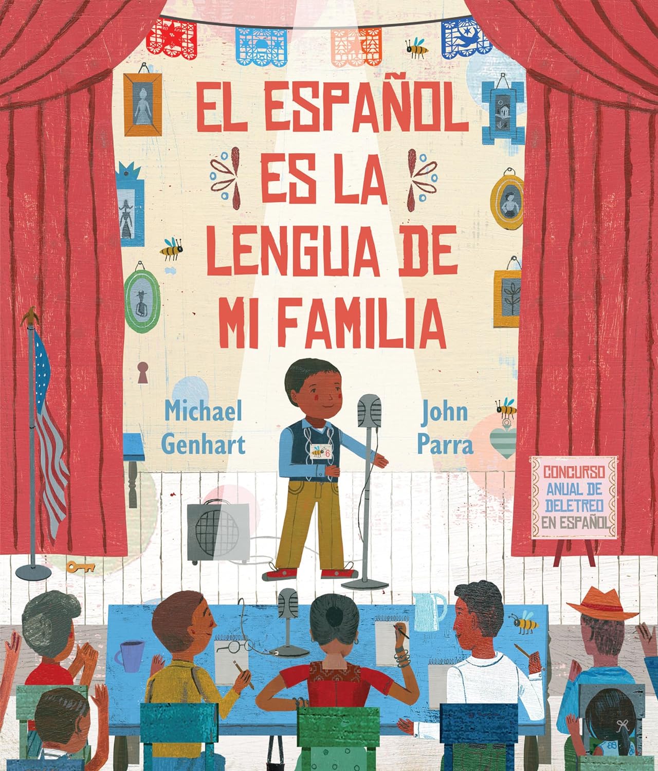 A child on stage with a microphone embodies cultural heritage in El español es la lengua de mi familia. A sign reading the title underscores Latino family ties, with authors Michael Genhart and John Parra. Flags and framed photos adorn the scene, evoking a Spanish spelling bee backdrop.