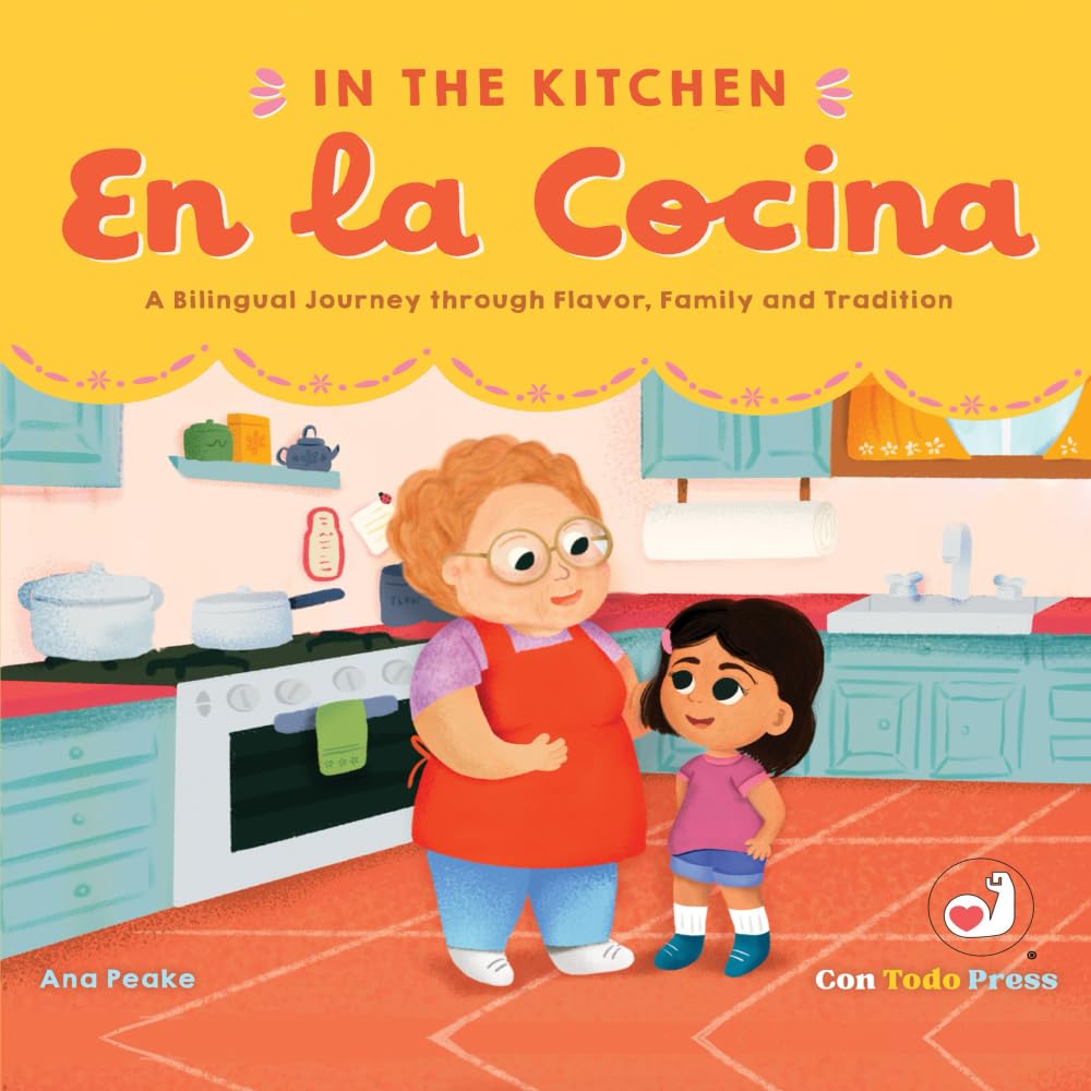 The book cover for En la Cocina: A Bilingual Journey through Flavor, Family, and Tradition by Ana Peake depicts an adult and child joyously cooking in a lively Latinx kitchen with cozy cabinets and appliances, featuring Spanish words. Published by Con Todo Press.
