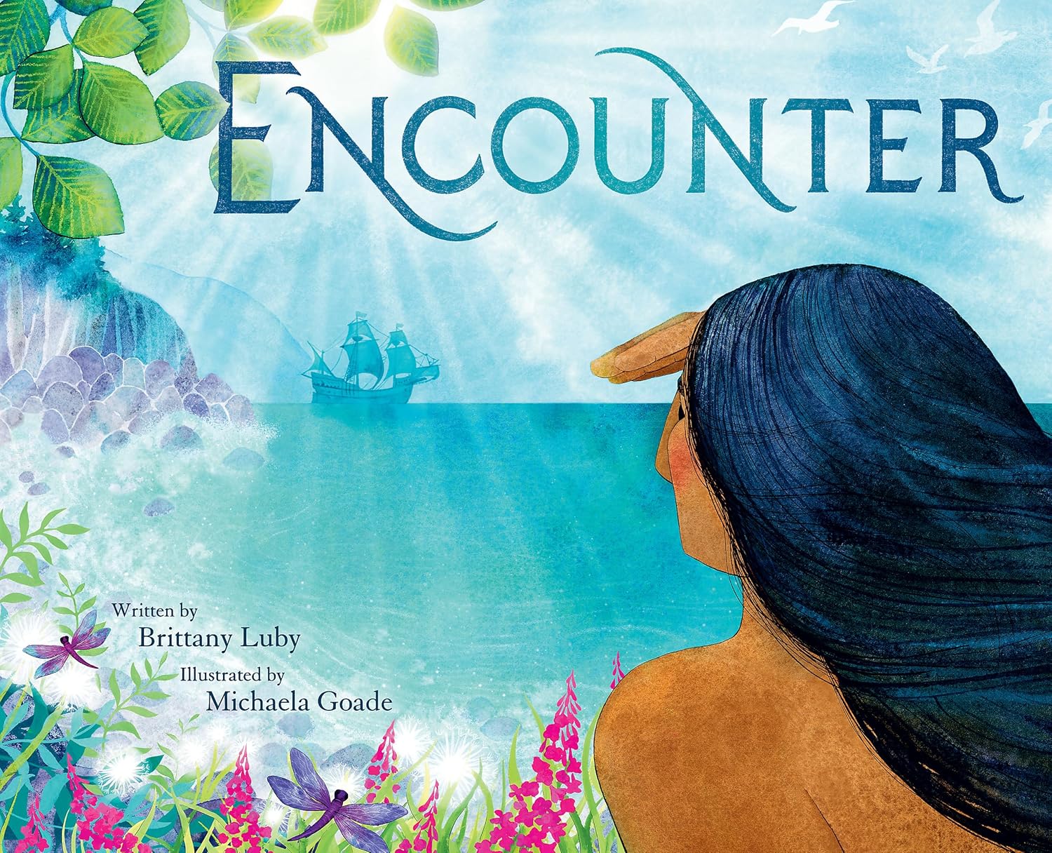The cover of the book Encounter by Indigenous creators Brittany Luby and Michaela Goade features a person with long dark hair gazing at a ship on the ocean, surrounded by vibrant foliage and flowers, showcasing Goades artistic flair.