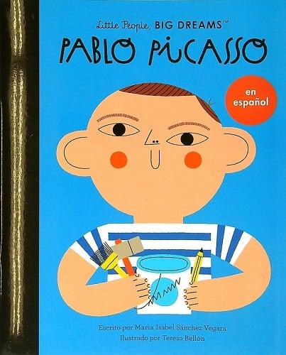 Cover of Pablo Picasso en Español, a Spanish childrens book. The illustration features a stylized child with art supplies, wearing a striped shirt and geometric facial features. Part of the popular Little People BIG DREAMS series.