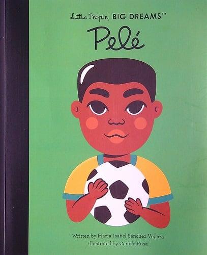 The Spanish edition of Pelé by Maria Isabel Sánchez Vegara, illustrated by Camila Rosa, has a book cover showing a cartoon child with a soccer ball set against a vibrant green background.